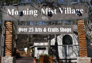 morning mist village sign in smoky mountain arts and crafts community